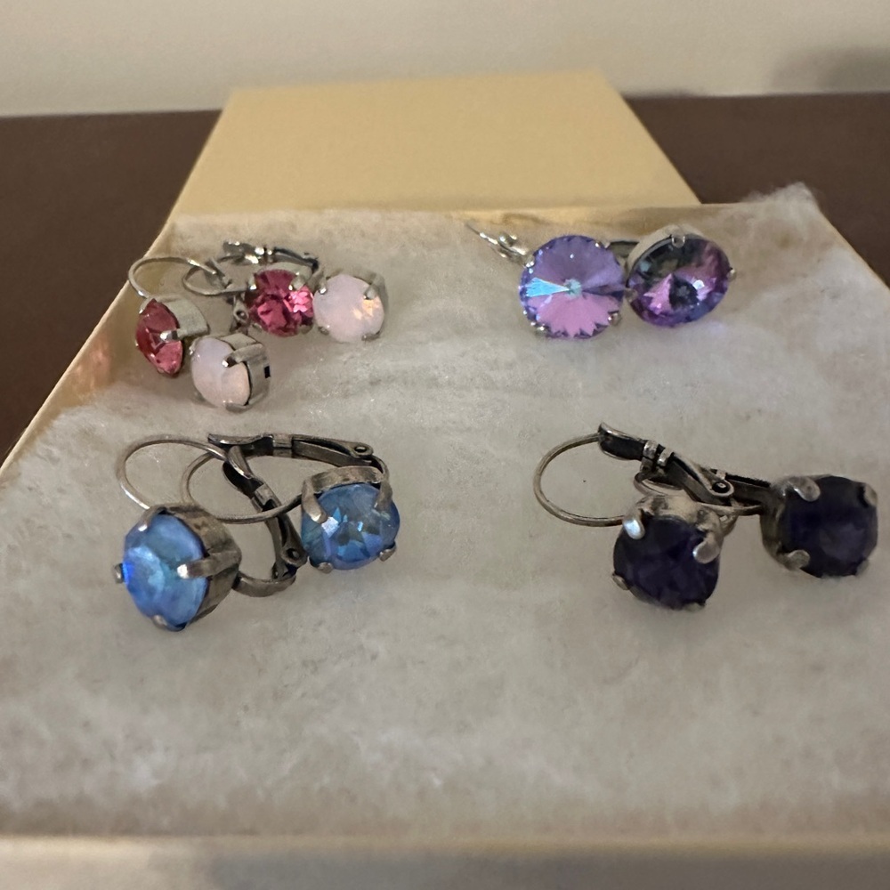 Swarovski crystal earrings 4 pair, pink, purple/blue, blue and dark purple.